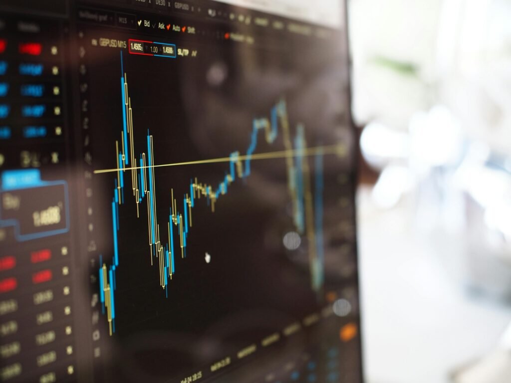 pexels-photo-159888-159888 Detailed view of financial trading graphs on a monitor, illustrating stock market trends.